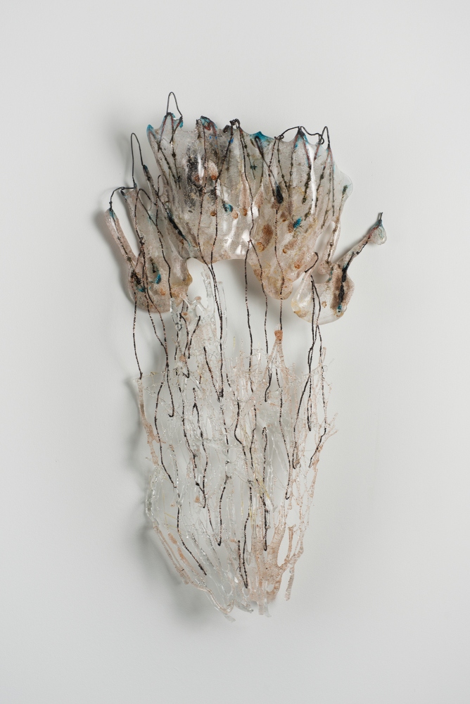 Wall sculpture of fragile glass lines