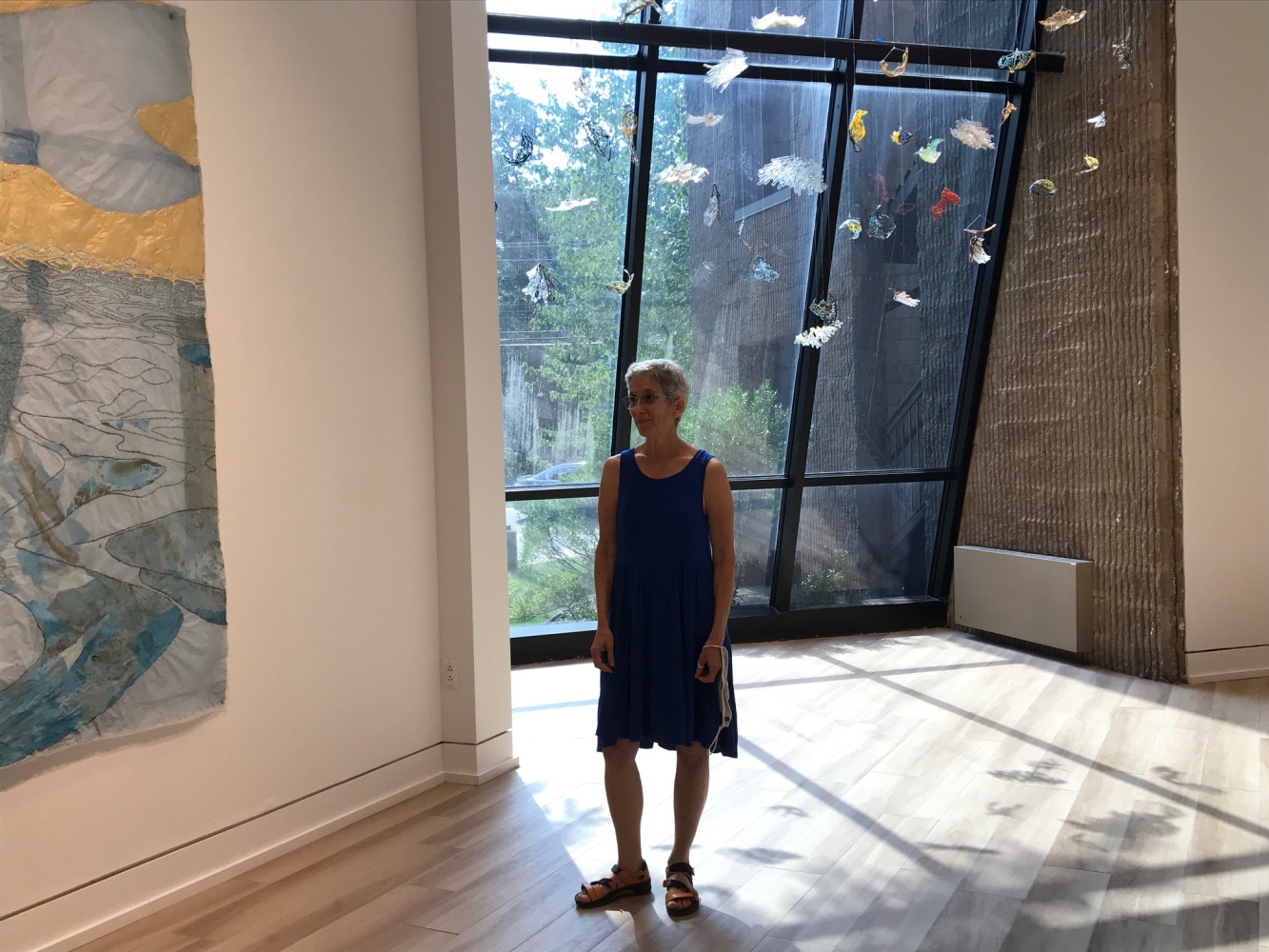photo of Nancy Cohen at her exhibition at the visual arts center of NJ