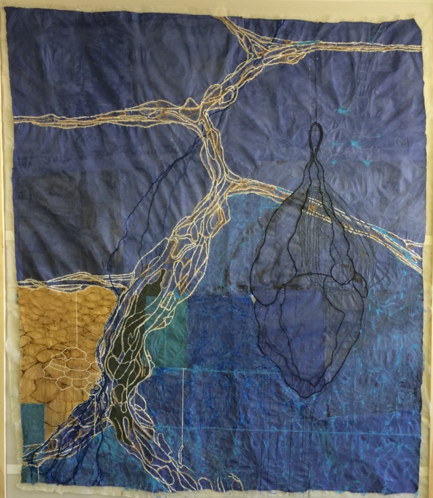 black and white organic line on a blue quilt like background.