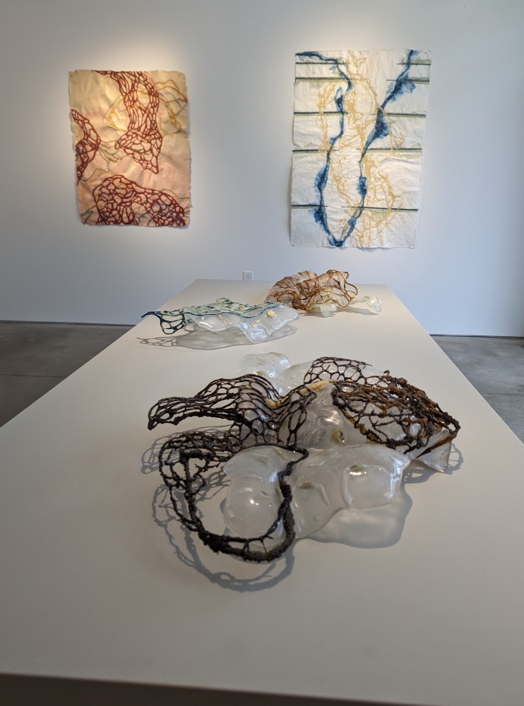 installation shot of exhibition with 2 drawings and 3 sculptures