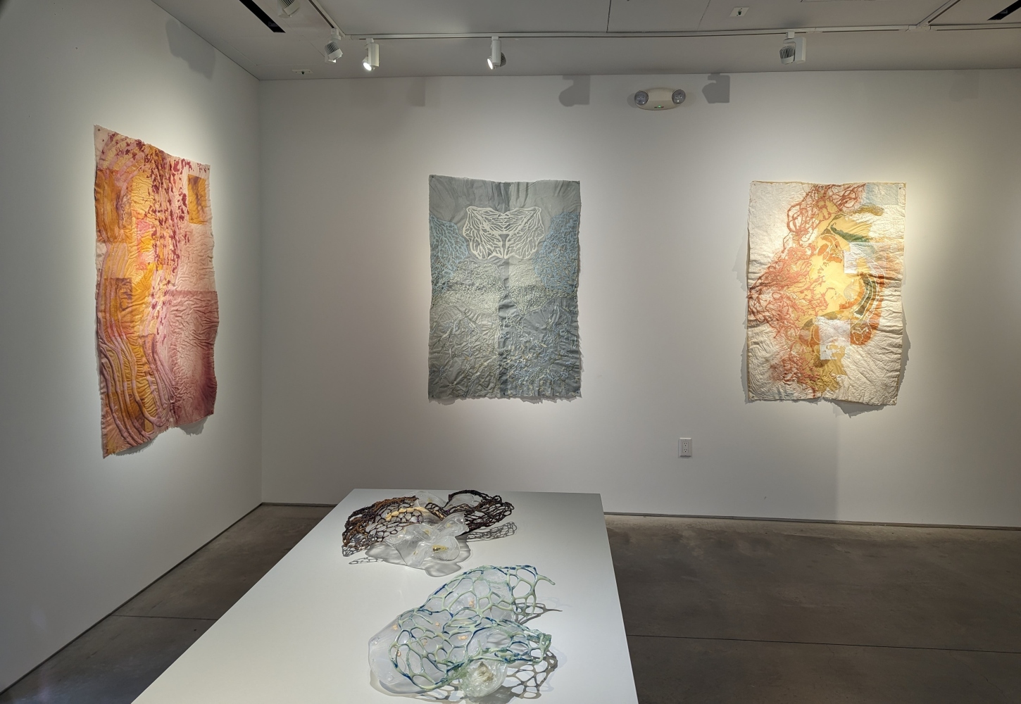 installation shot of exhibition with 3 drawings and 2 sculptures