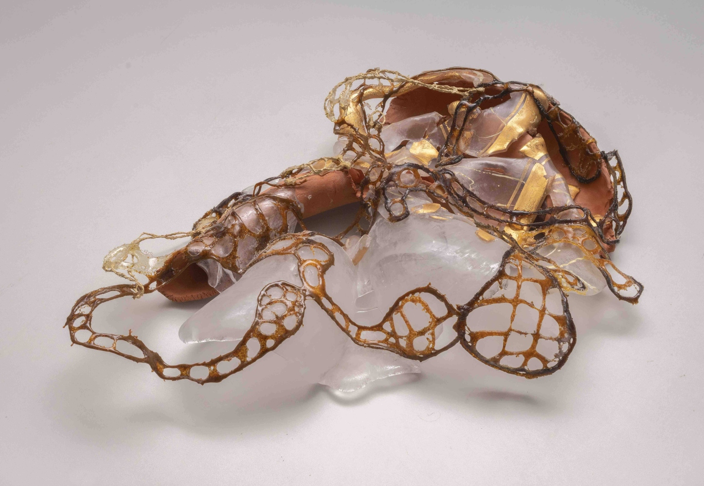 Overlapping organic shapes in glass, clay and wire