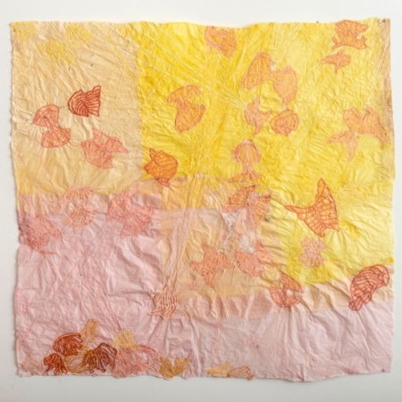 pink and yellow wing like shapes on handmade paper