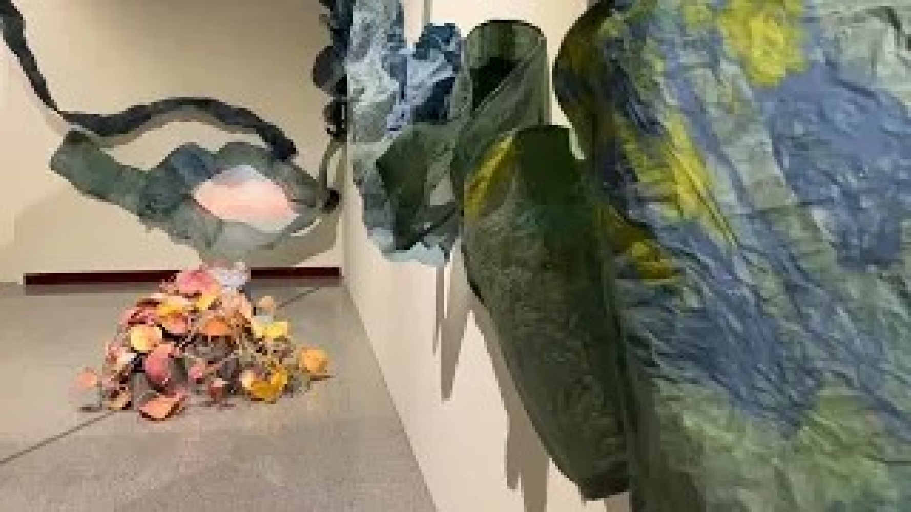 video of the introduction to once she dries, paper sculpture on the wall and floor