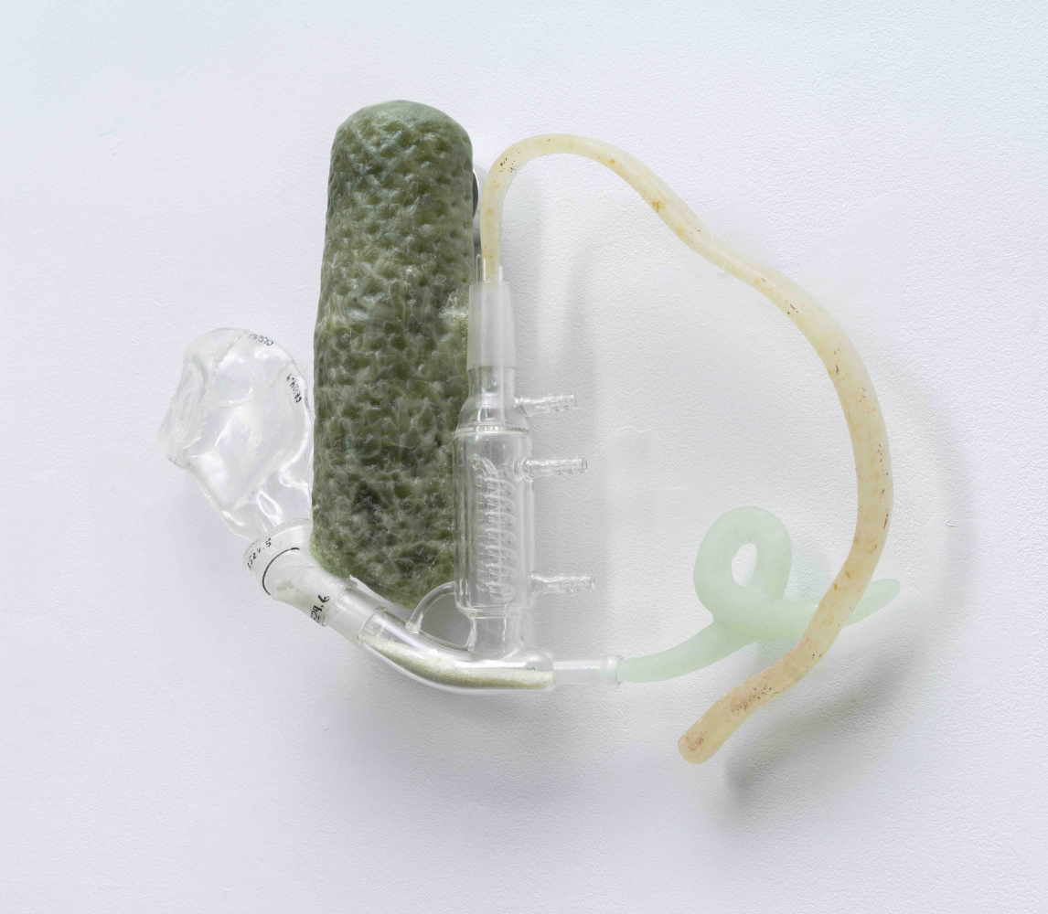 circular glass wall sculpture that feels like a science project but is not