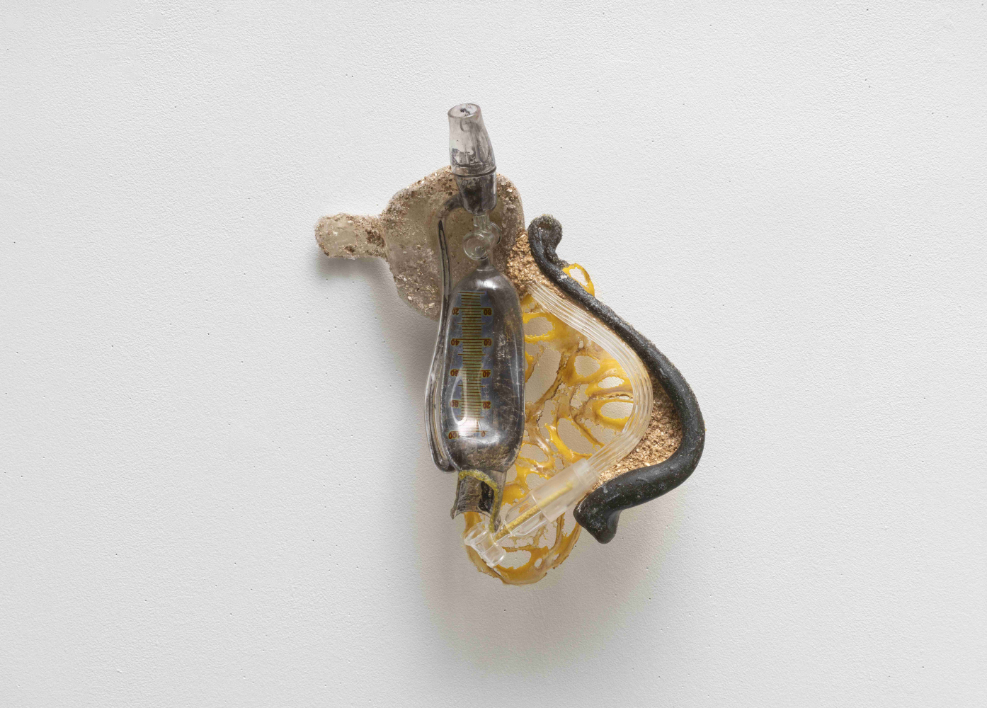 brown and yellow abstract wall sculpture of organic glass shapes