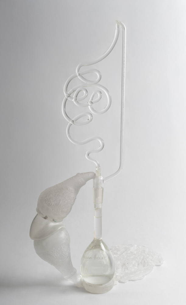 clear glass pedestal sculpture that brings to mind the movement of water