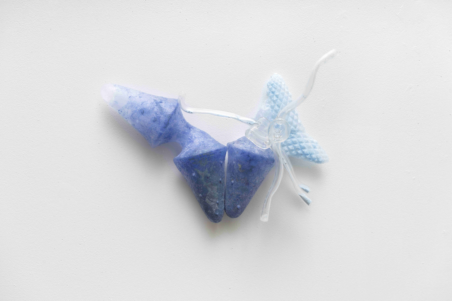 abstract blue glass wall sculpture that looks like wings